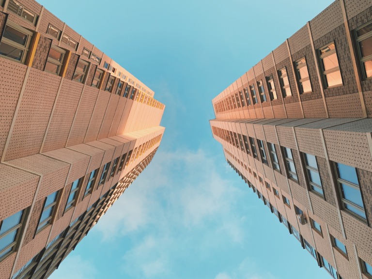 brown concrete building under blue sky during daytime